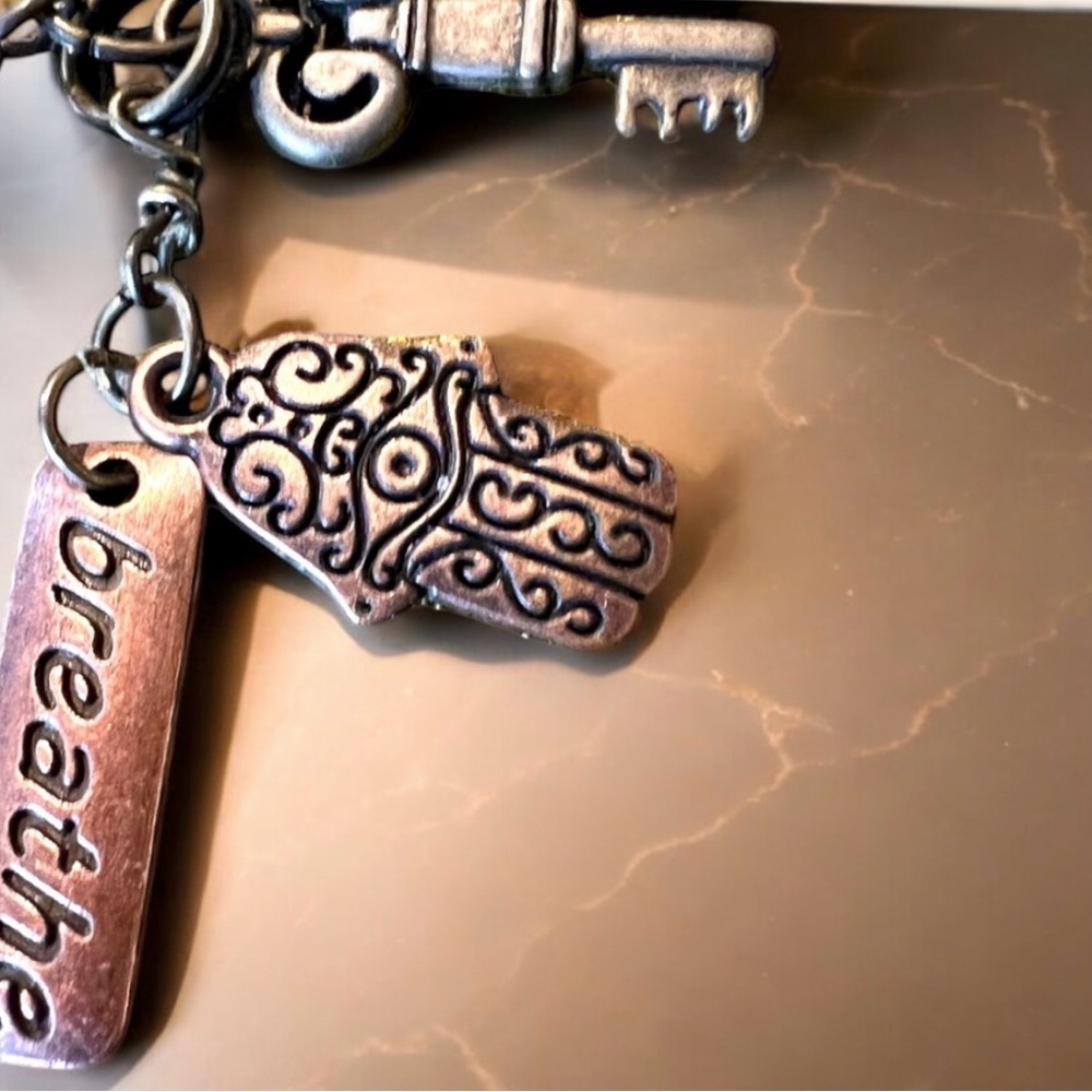 Unique bronze necklace key and charm details clear glass bead and 'breathe' tag. - Picture 11 of 15